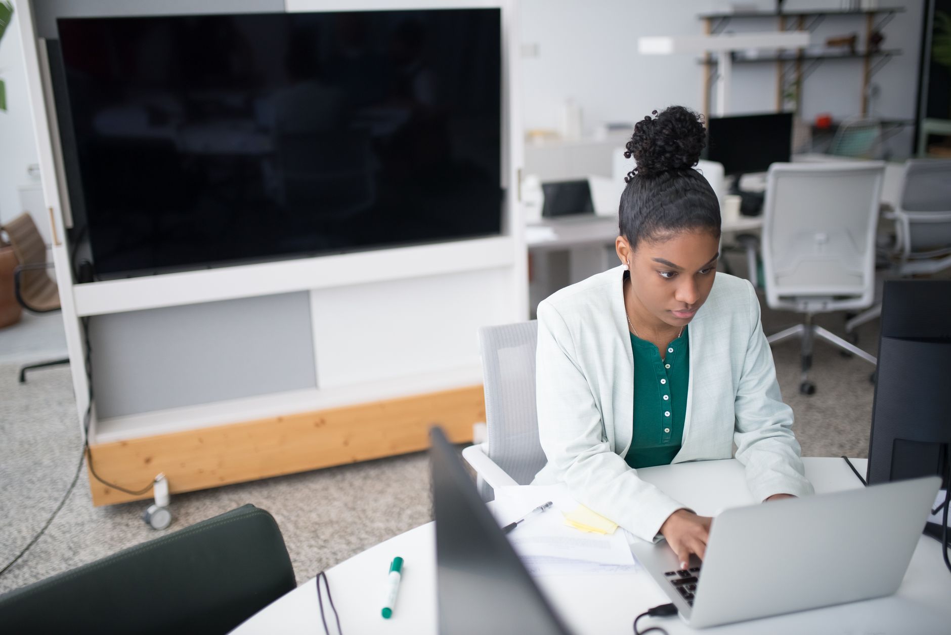 Focused person working with a laptop