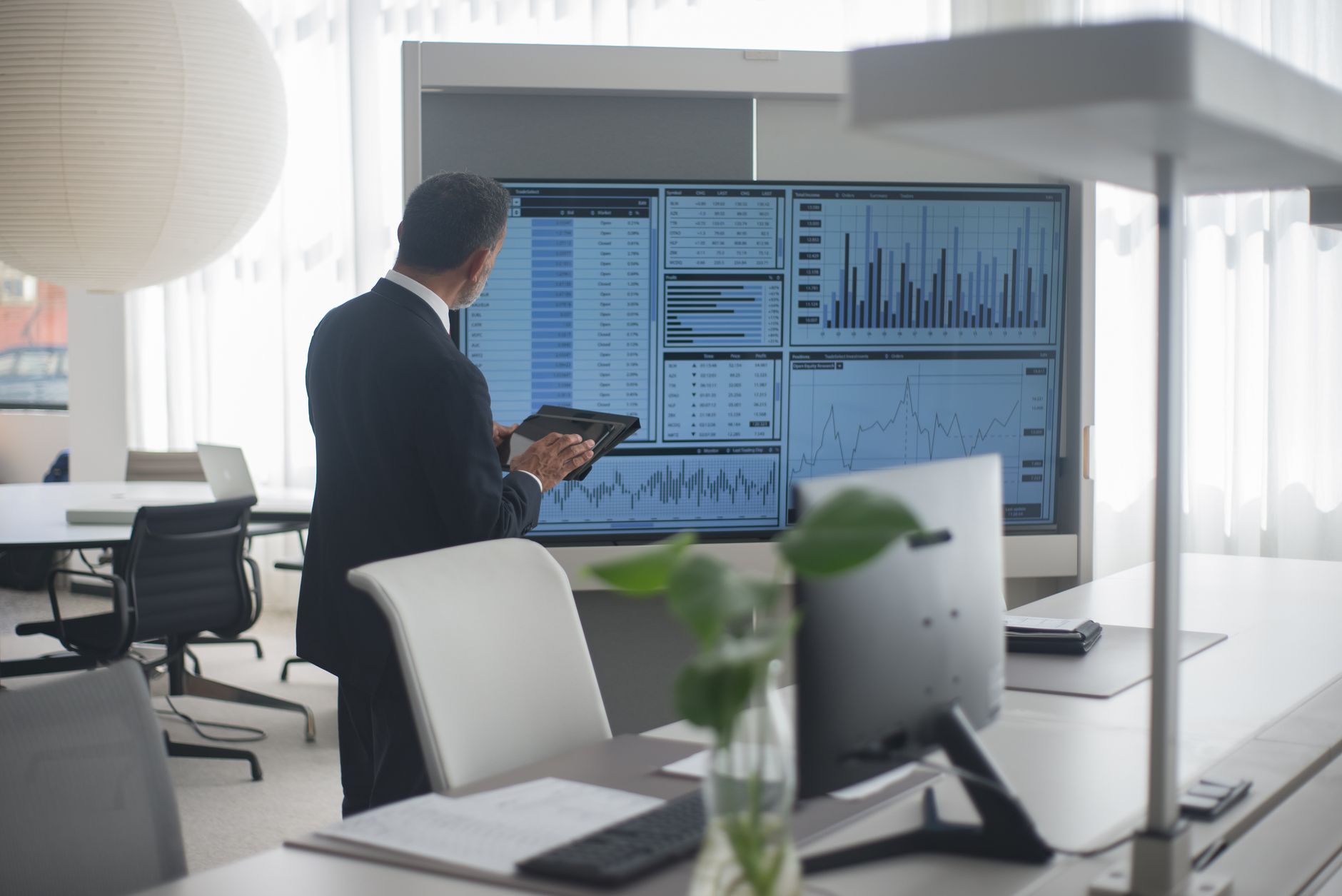 Professional analyzing information on a screen